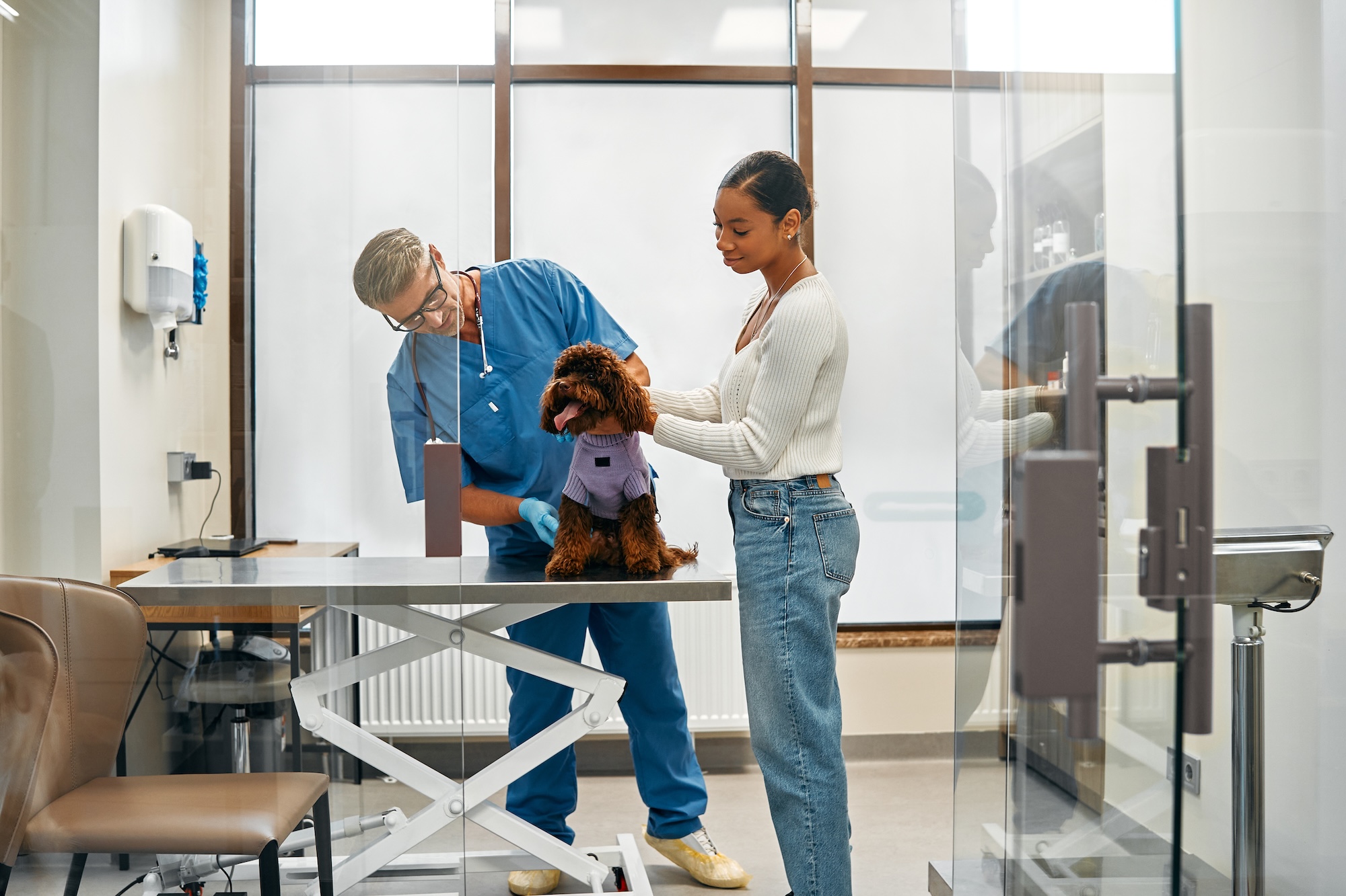 man and woman cleaning table for cleaning company at veterinary office in phoenix az