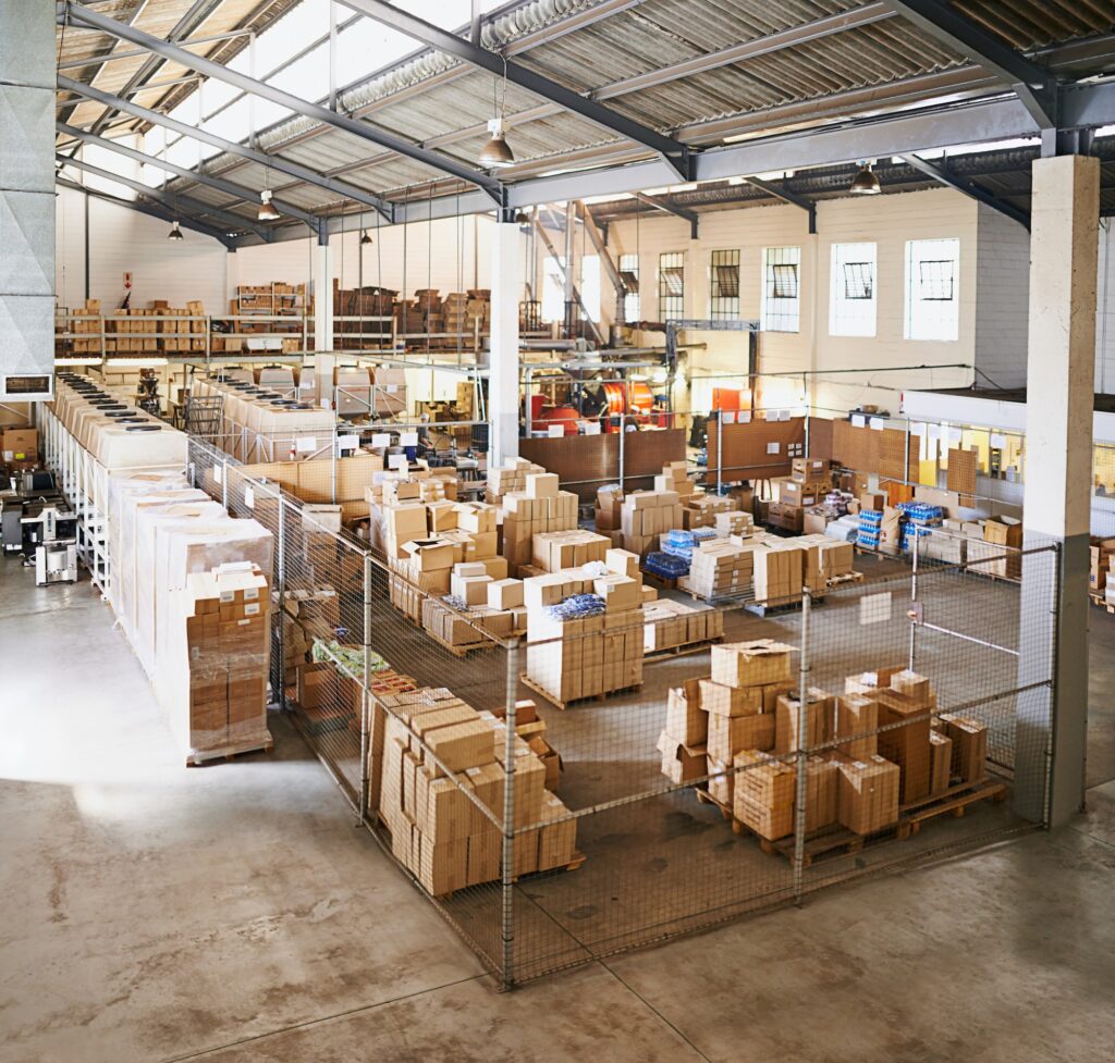 Warehouse with cardboard boxes needing a cleaning company in tempe arizona