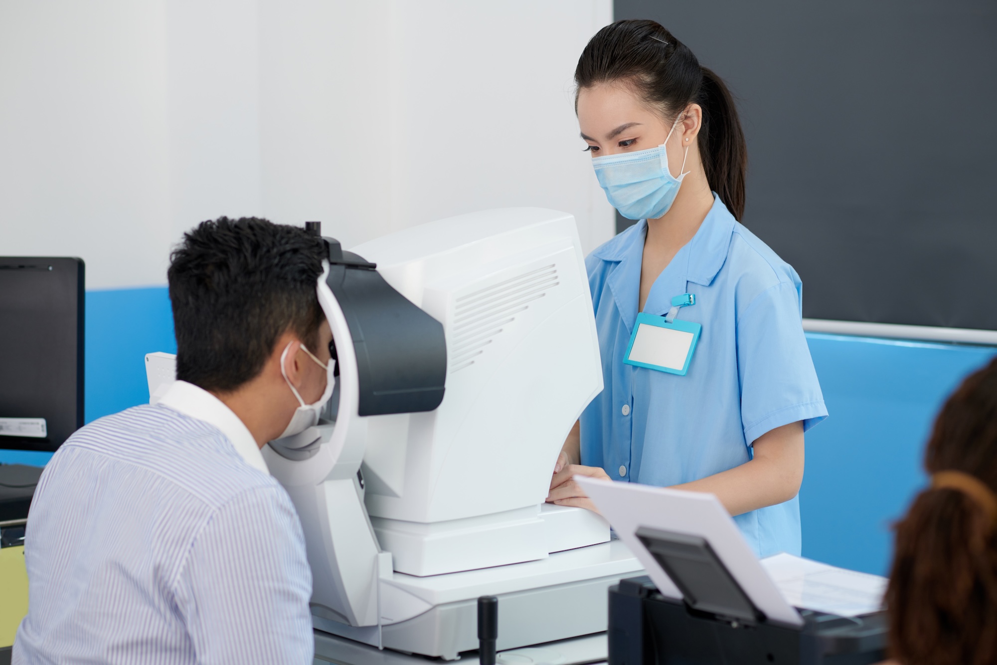 optometry office with doctor and patient cleaning equipment for company in phoenix az