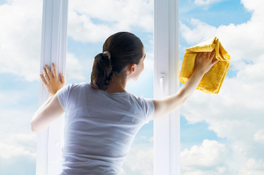 Commercial cleaner Woman washing windows office cleaner in Gilbert Arizona