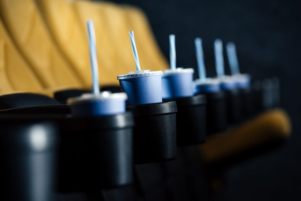 a movie theater with drink cups that need to be picked up and cleaned by the cleaning company in tempe