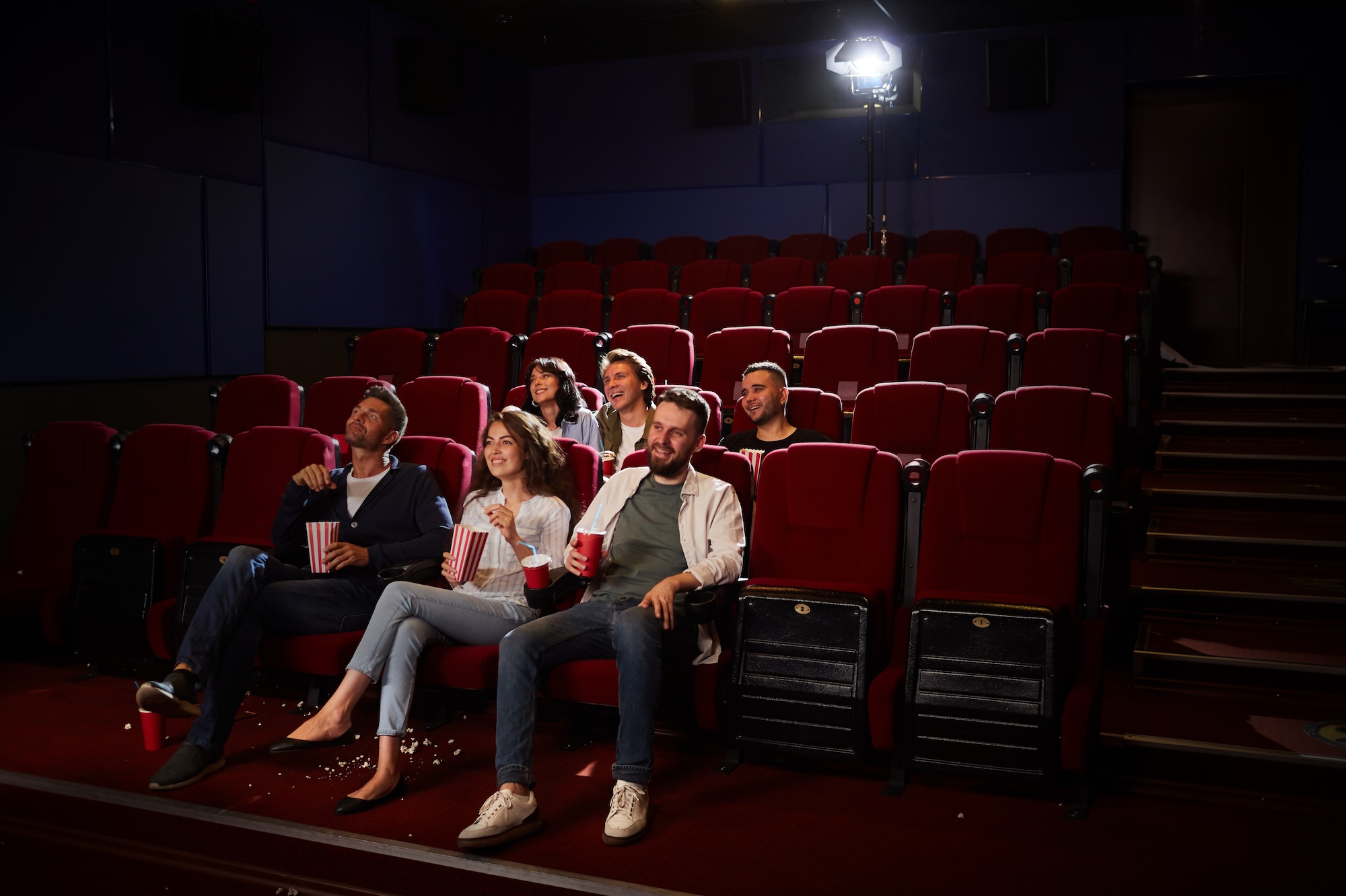 people at the movie theater waiting for the movie theater cleaners from the company to arrive to vacuum in phoenix